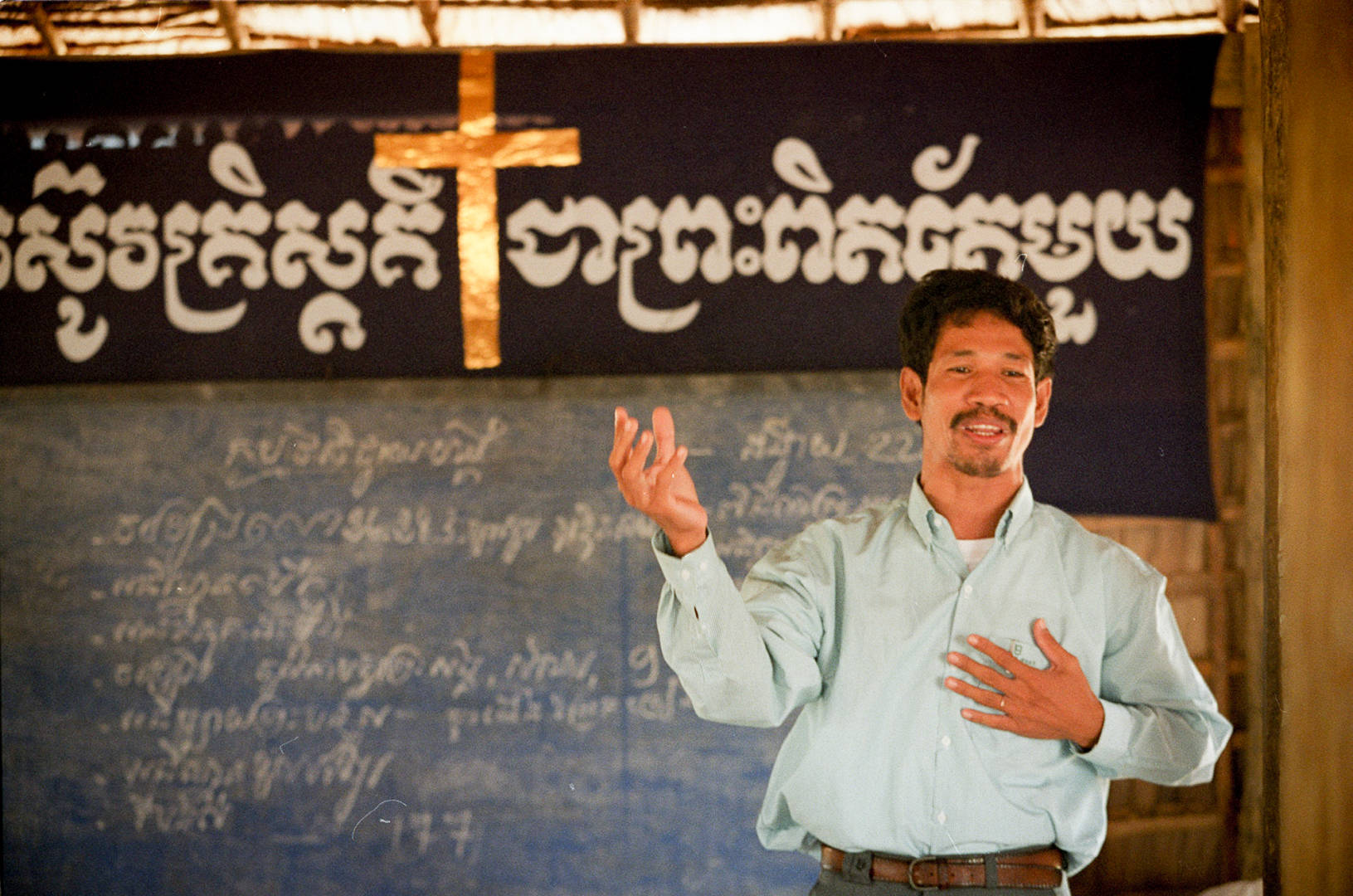 Pastor in Cambodia preaches in a local church.