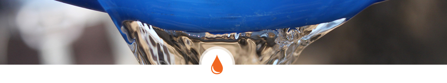 Clean water pouring out of a bucket