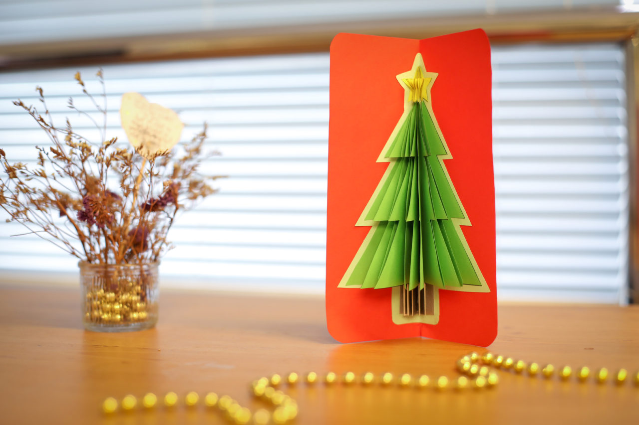 Christmas card with Christmas tree made from construction paper. 