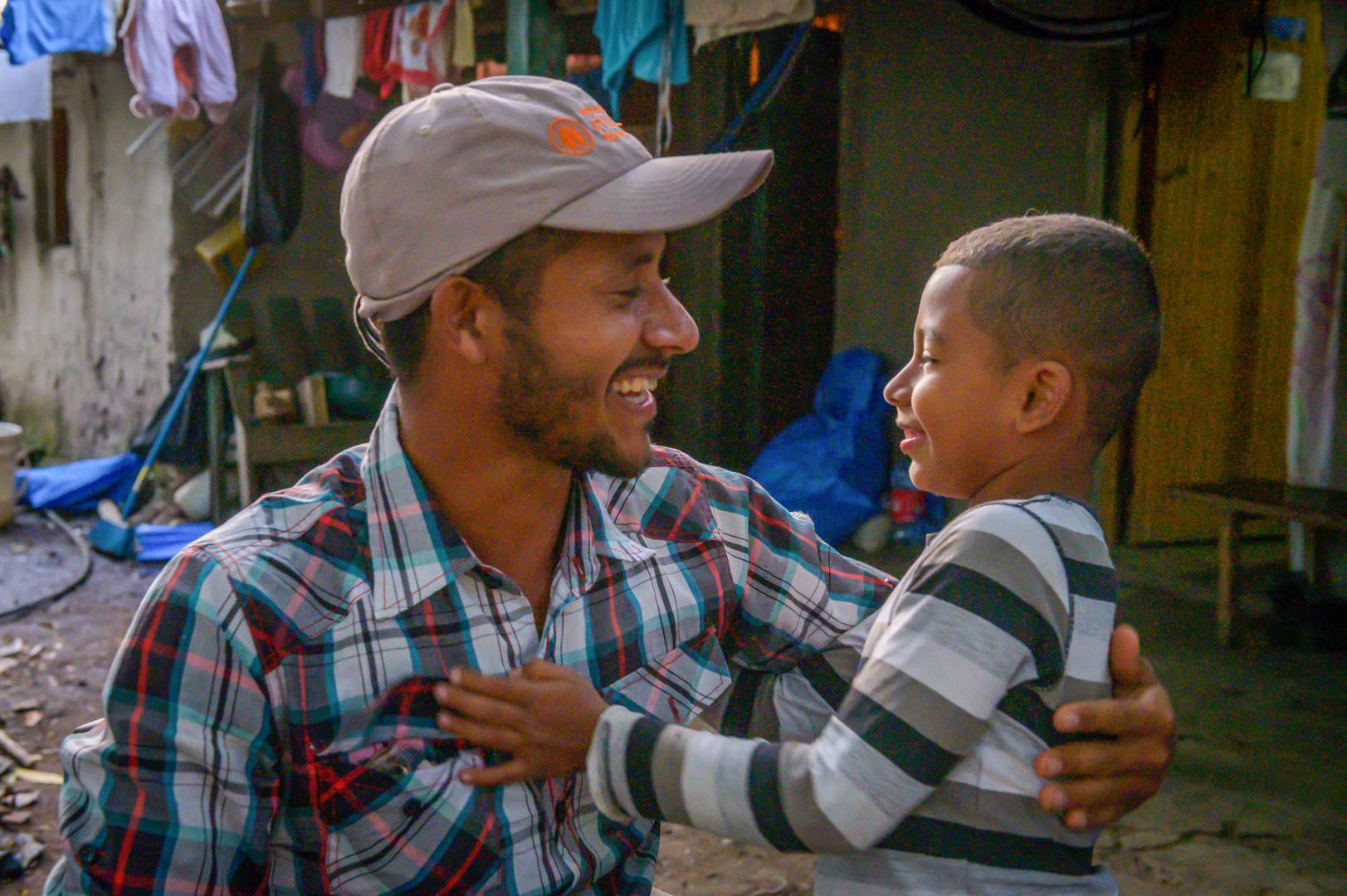 A tender moment between father and son.