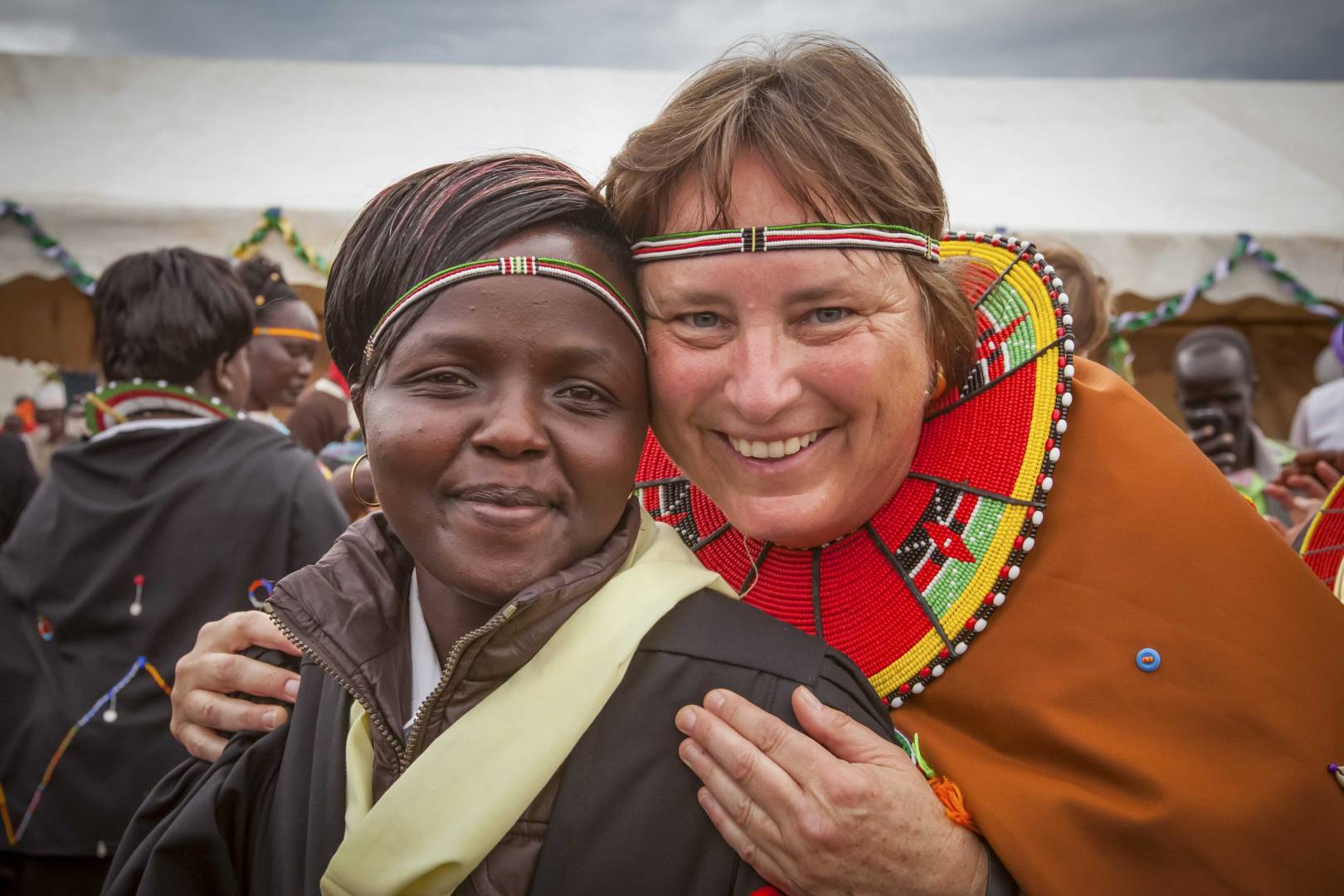 Margo Day smiles with a friend named Lillian during Margo&rsquo;s 2014 trip to Kenya to celebrate an expansion of the school she funded. She initially met Lillian during a 2009 visit at the rescue center.