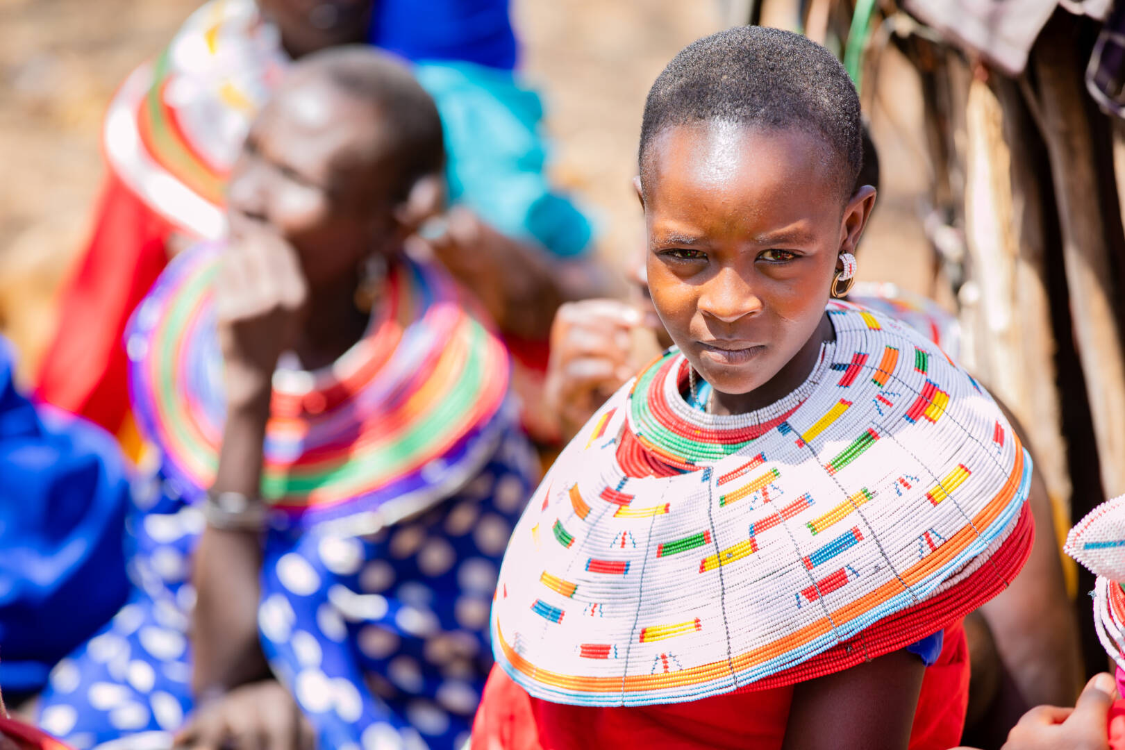 Girl in Samburu, Kenya, wearing traditional clothing and beaded collar necklace.