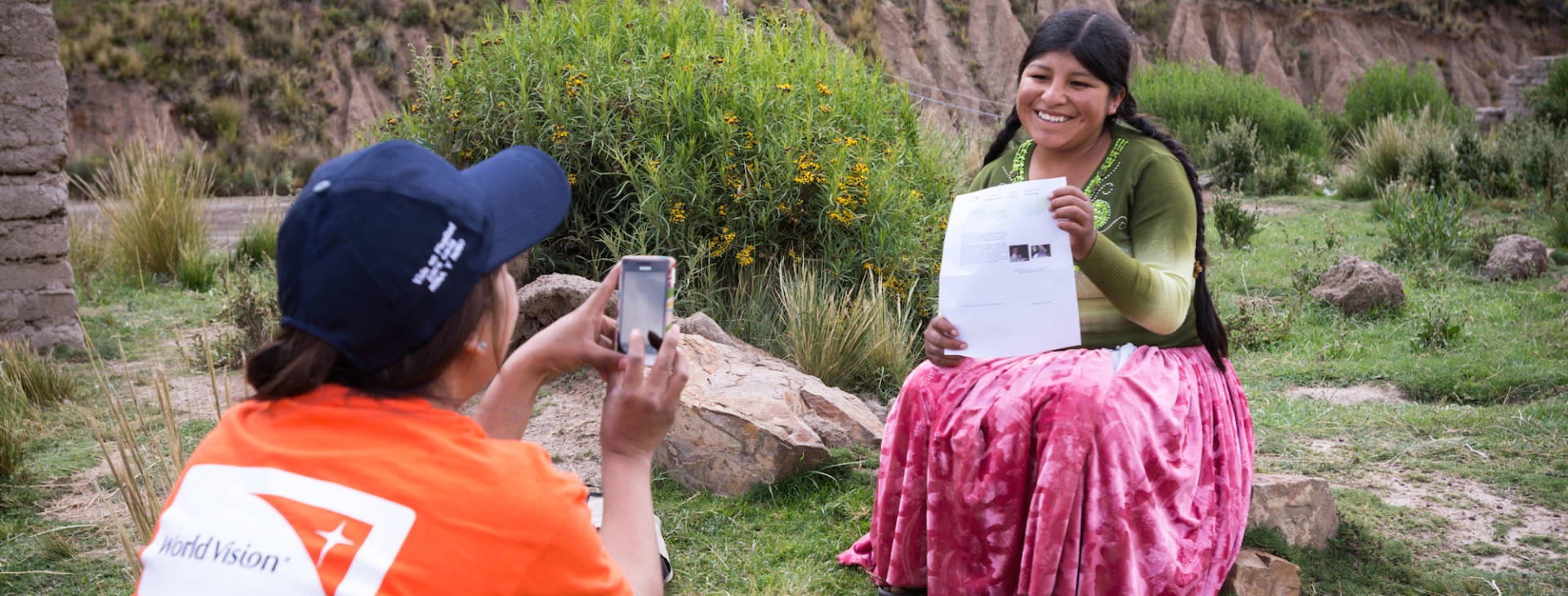 sponsored child holding printed email from her sponsor @2016 World Vision