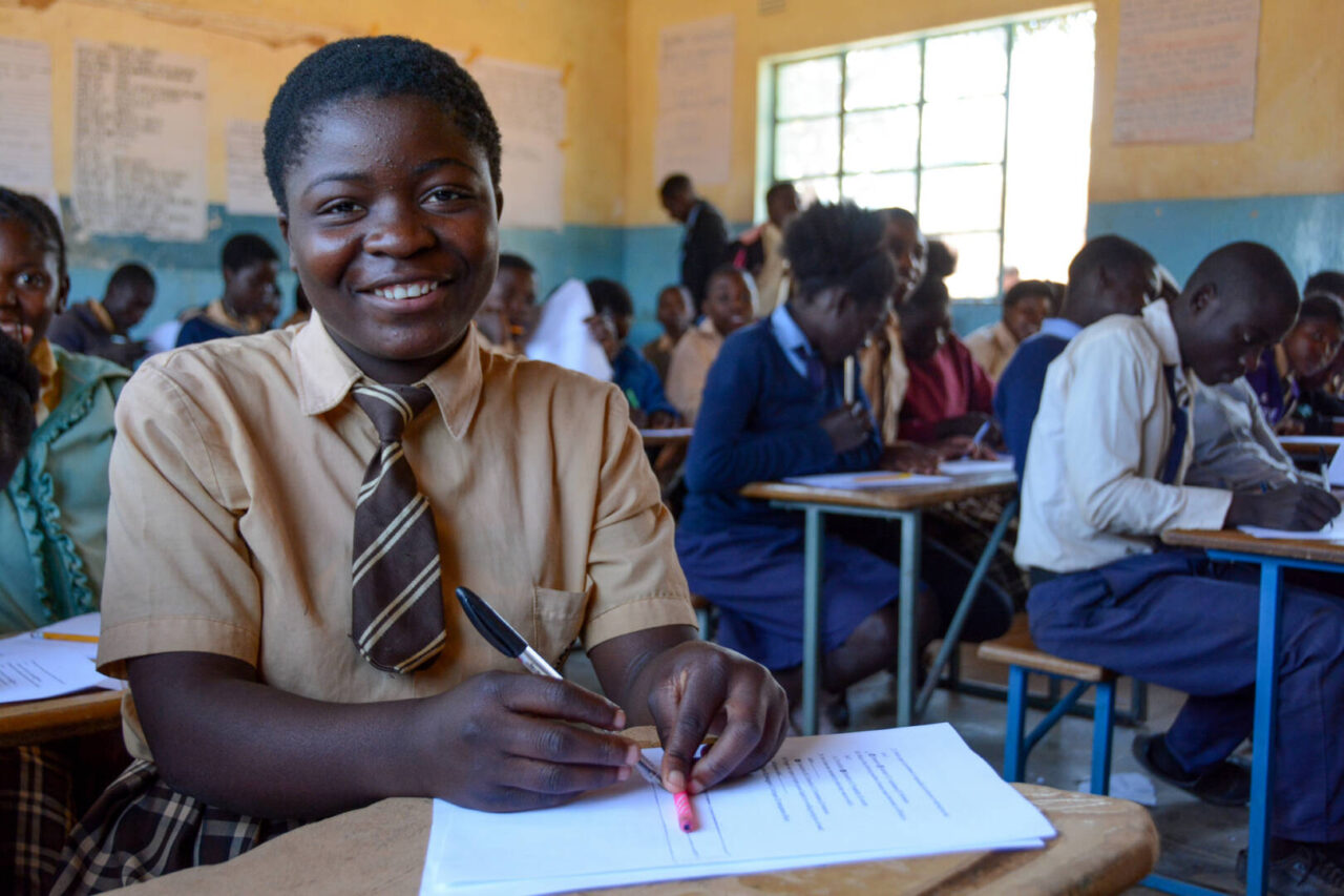 Access to education can lead to an empowered life for Mary and the students around her in this Zambian classroom.